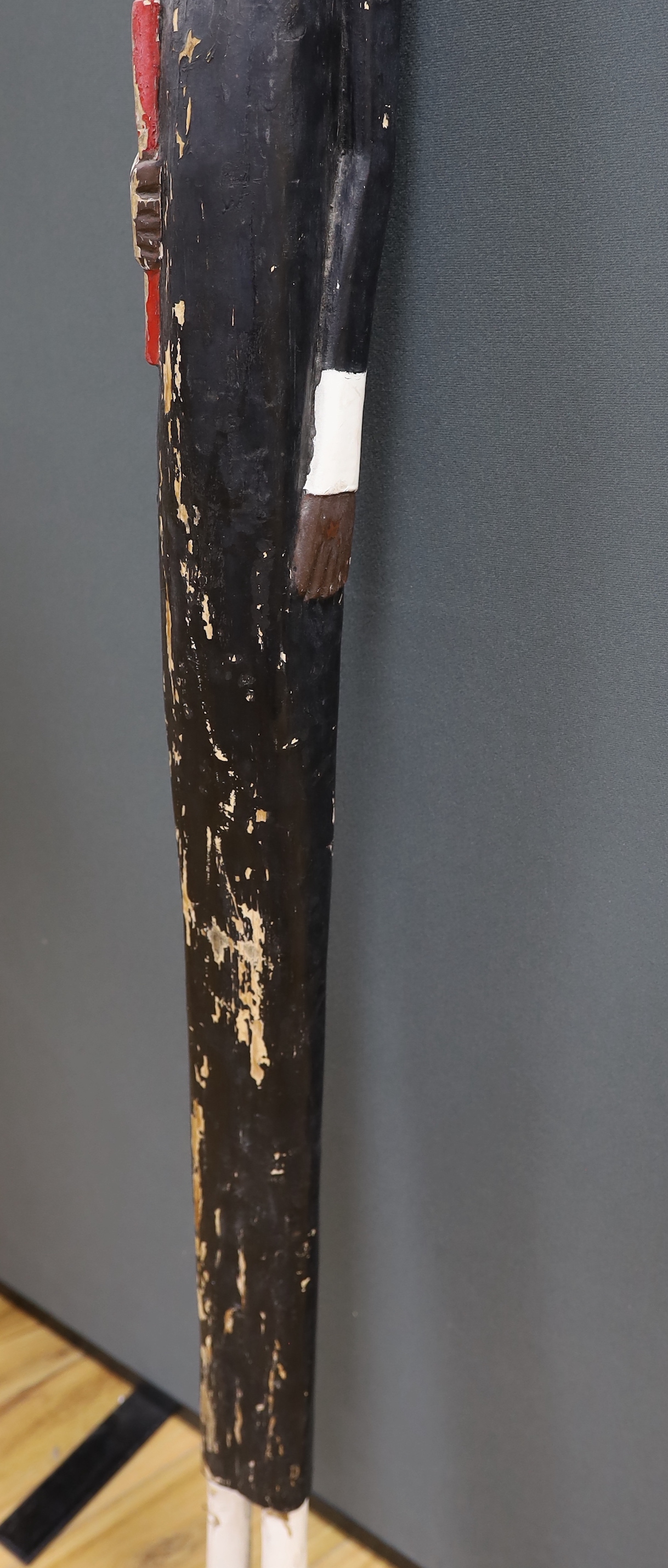 A colonial carved and painted wood novelty figure, 150cm high